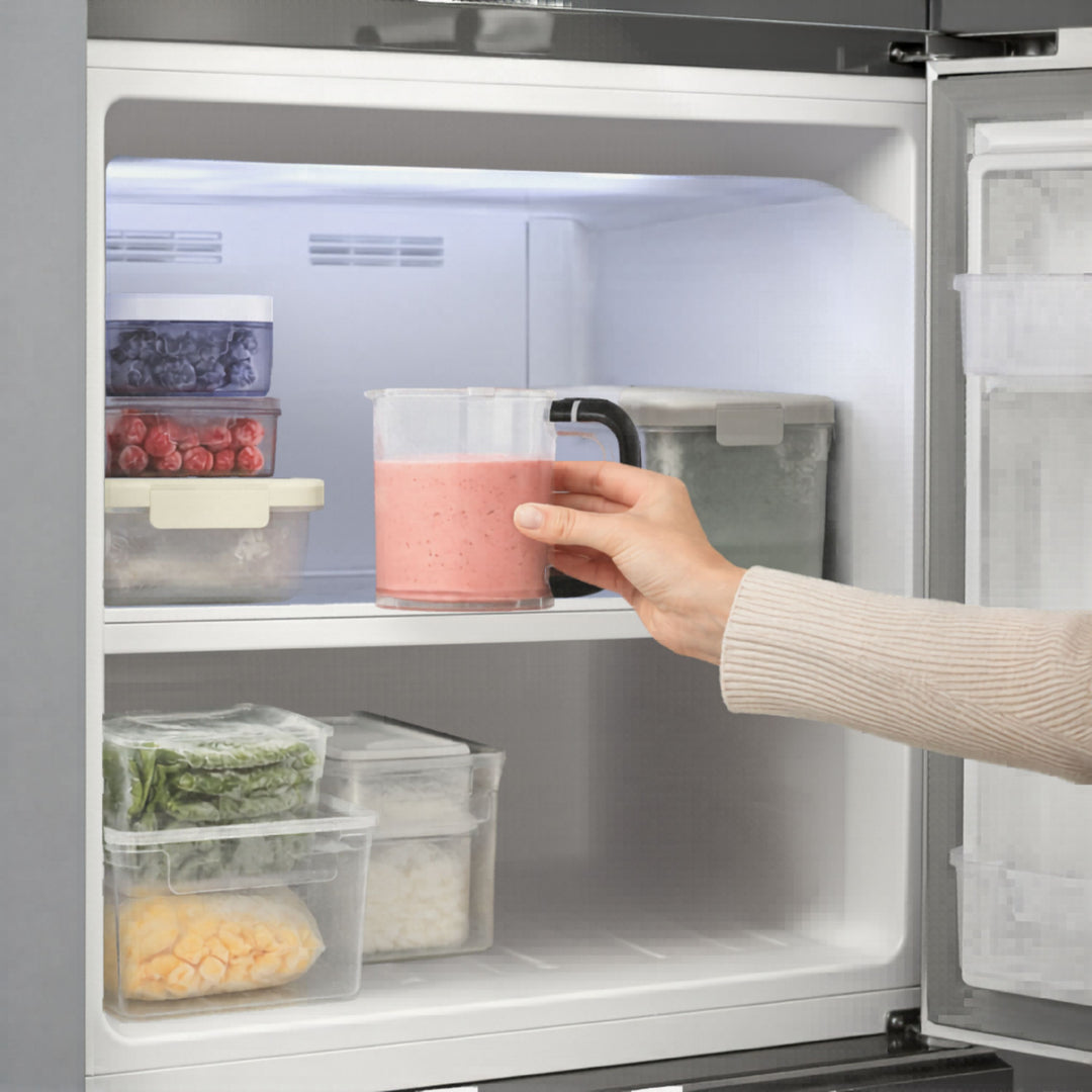 Person placing homemade ice cream mixture into the freezer