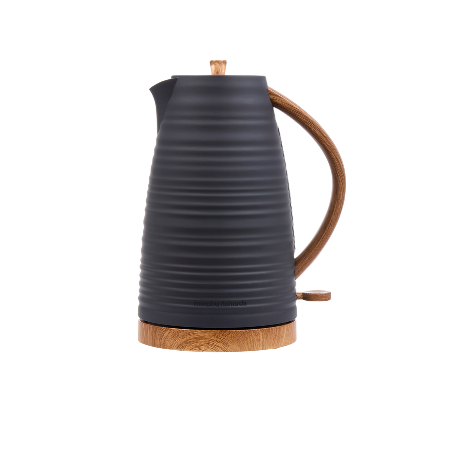 Black electric kettle with wooden base and handle on a white background